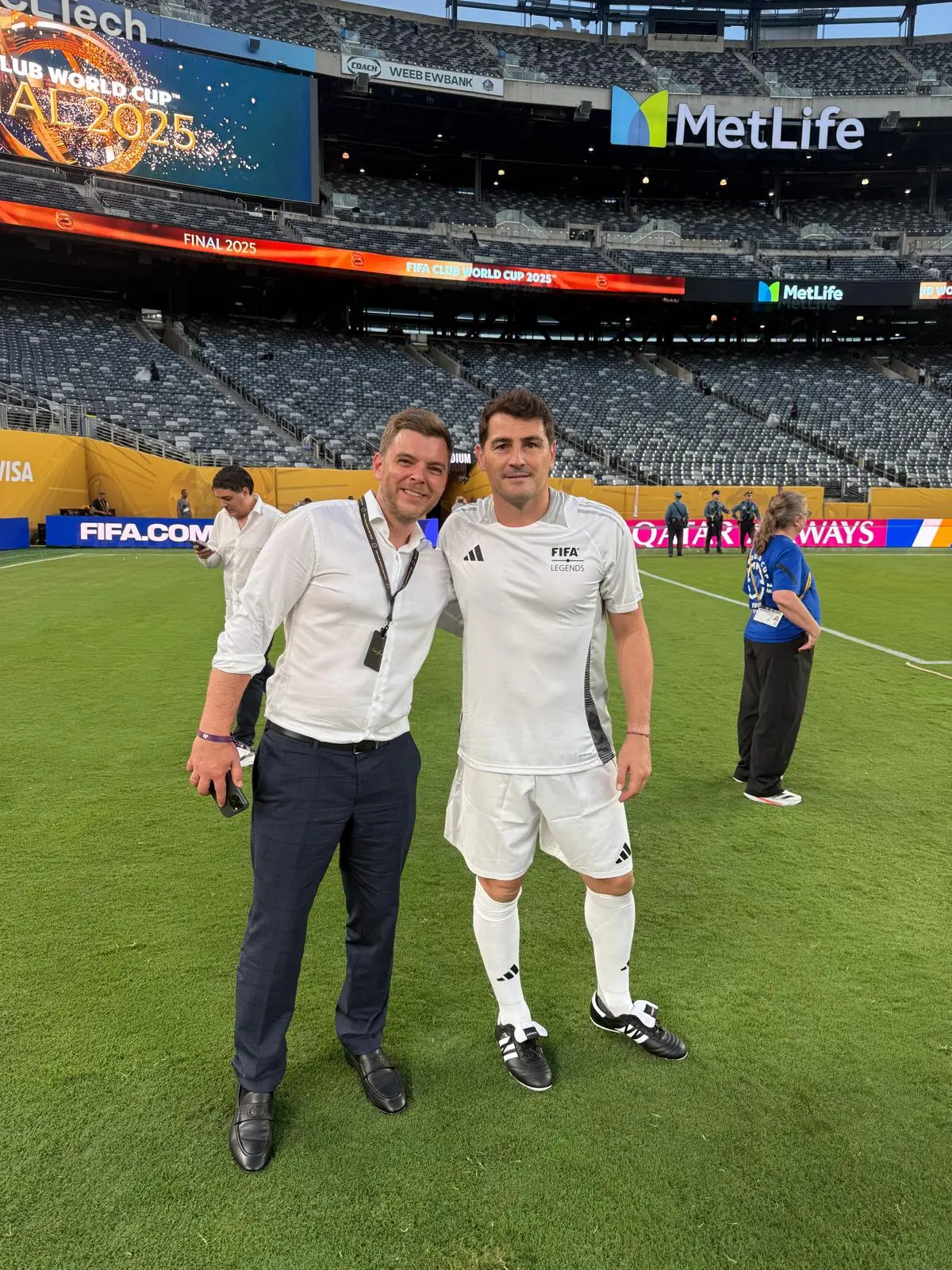 Filipp Sviridenko and Iker Casillas, in a FIFA Legends kit, on the pitch at MetLife Stadium